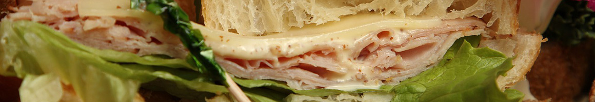 Eating Sandwich Cafe at Espresso Love restaurant in Edgartown, MA.